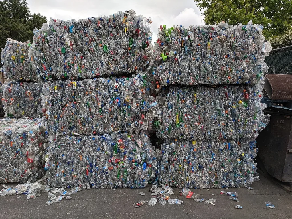 Stacked bales of used plastic bottles awaiting recycling